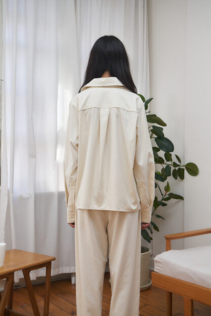 raw silk shirt with front pocket and long sleeves. unbleached ecru color. Backside view